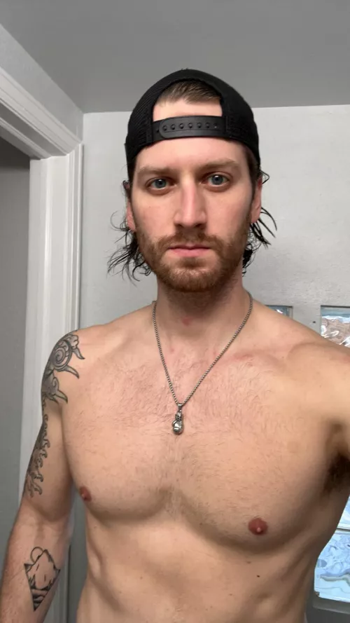 Tall, tatted, bearded. š