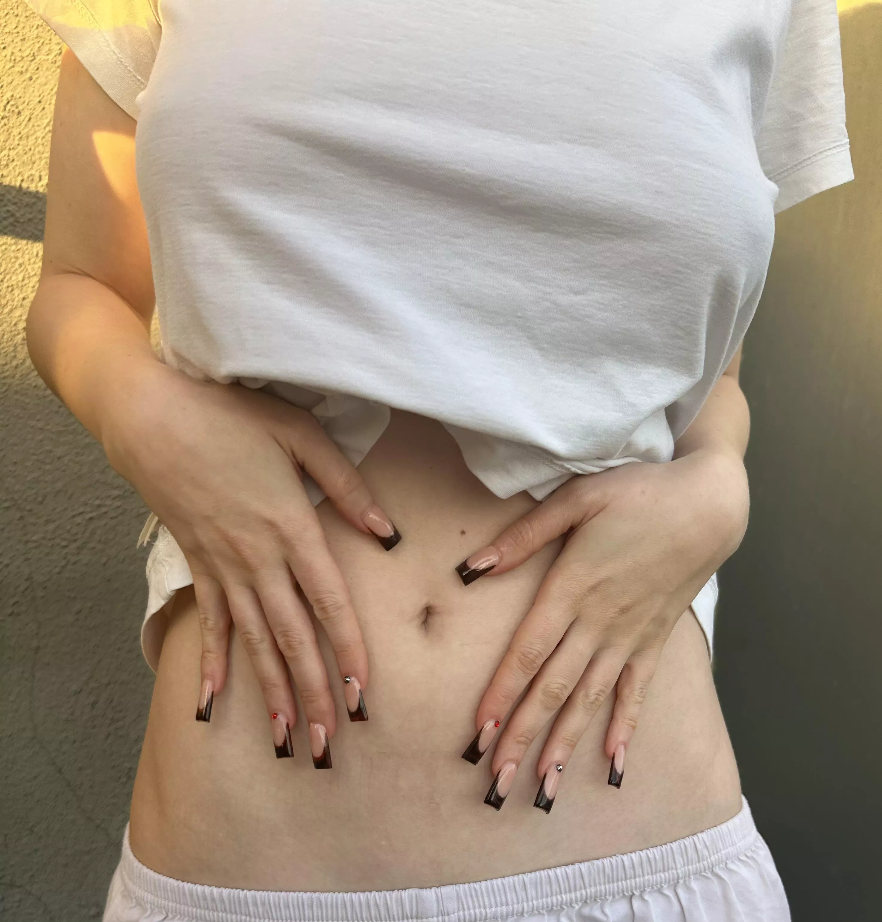 The great feeling of touching my skin with the tip of my new nails!