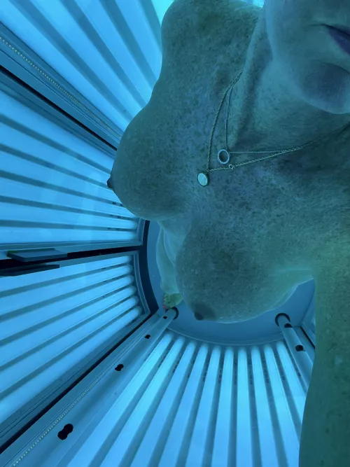 Boobs in blue getting some vitamin D