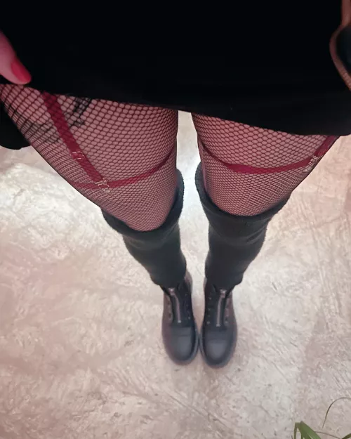 Boots, fishnets, leg warmers and a short skirt for this chilly day
