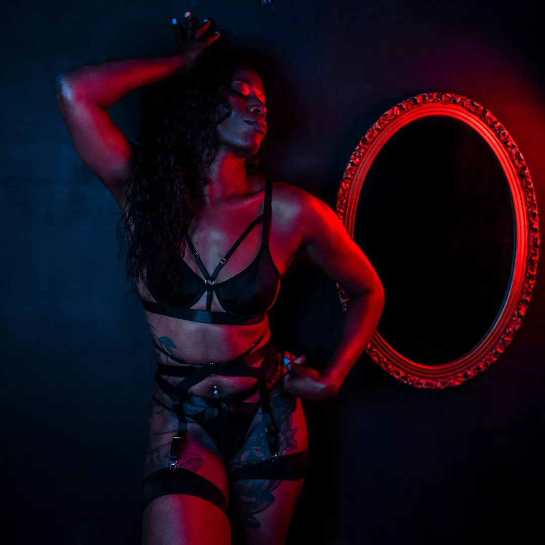 Ms. S in black lingerie.