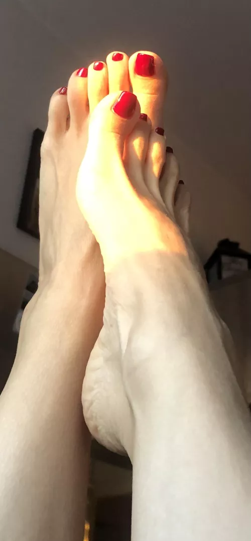 My feet and the glare of the sun's rays