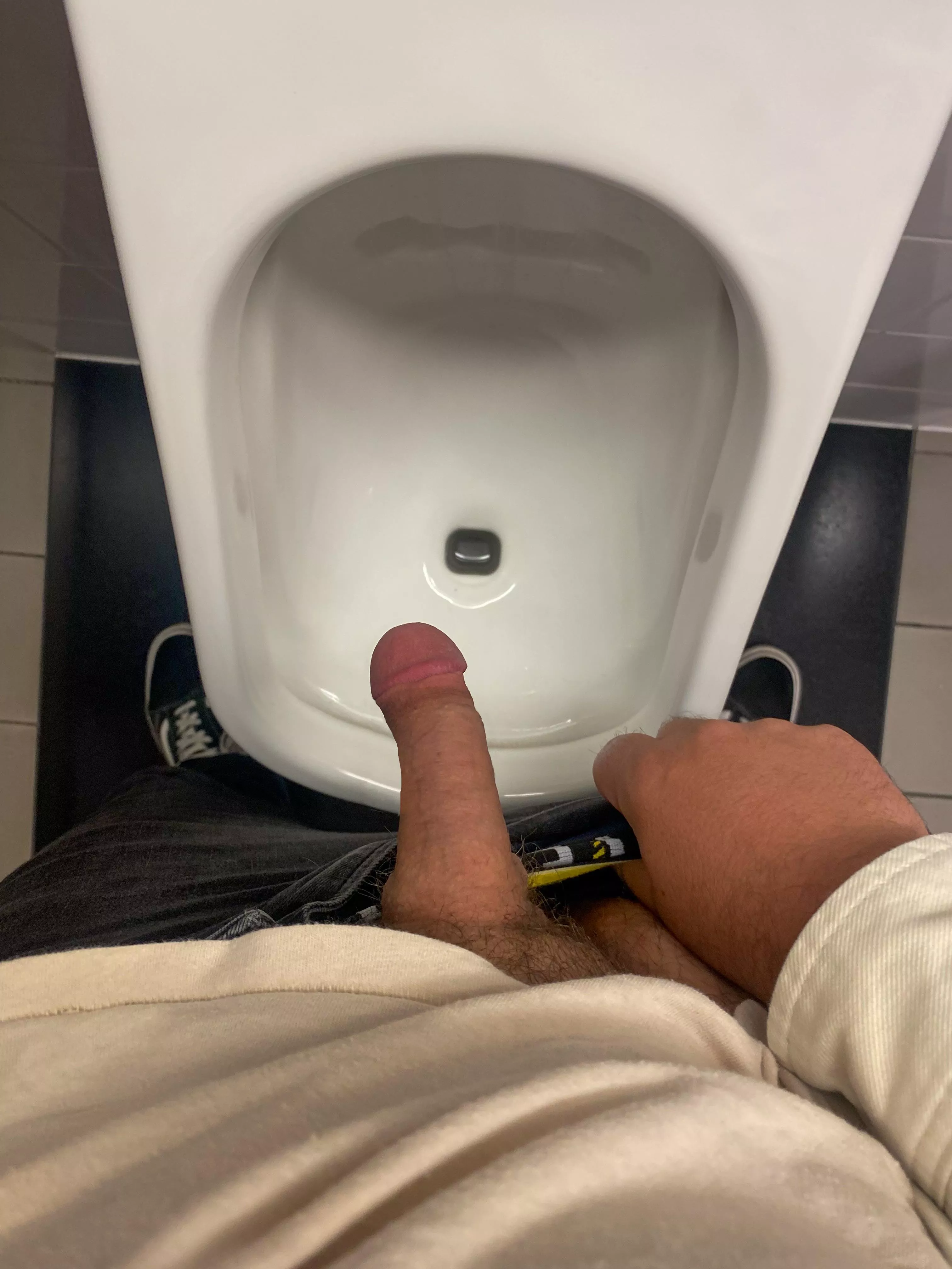 At work urinals with my soft cock out. Hoping the boss will catch a a glimpse.
