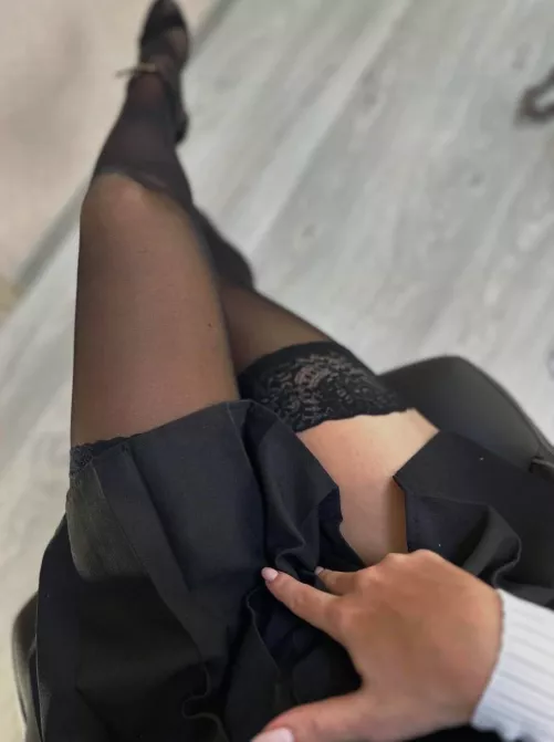 Bending on the bed in my seamed stockings