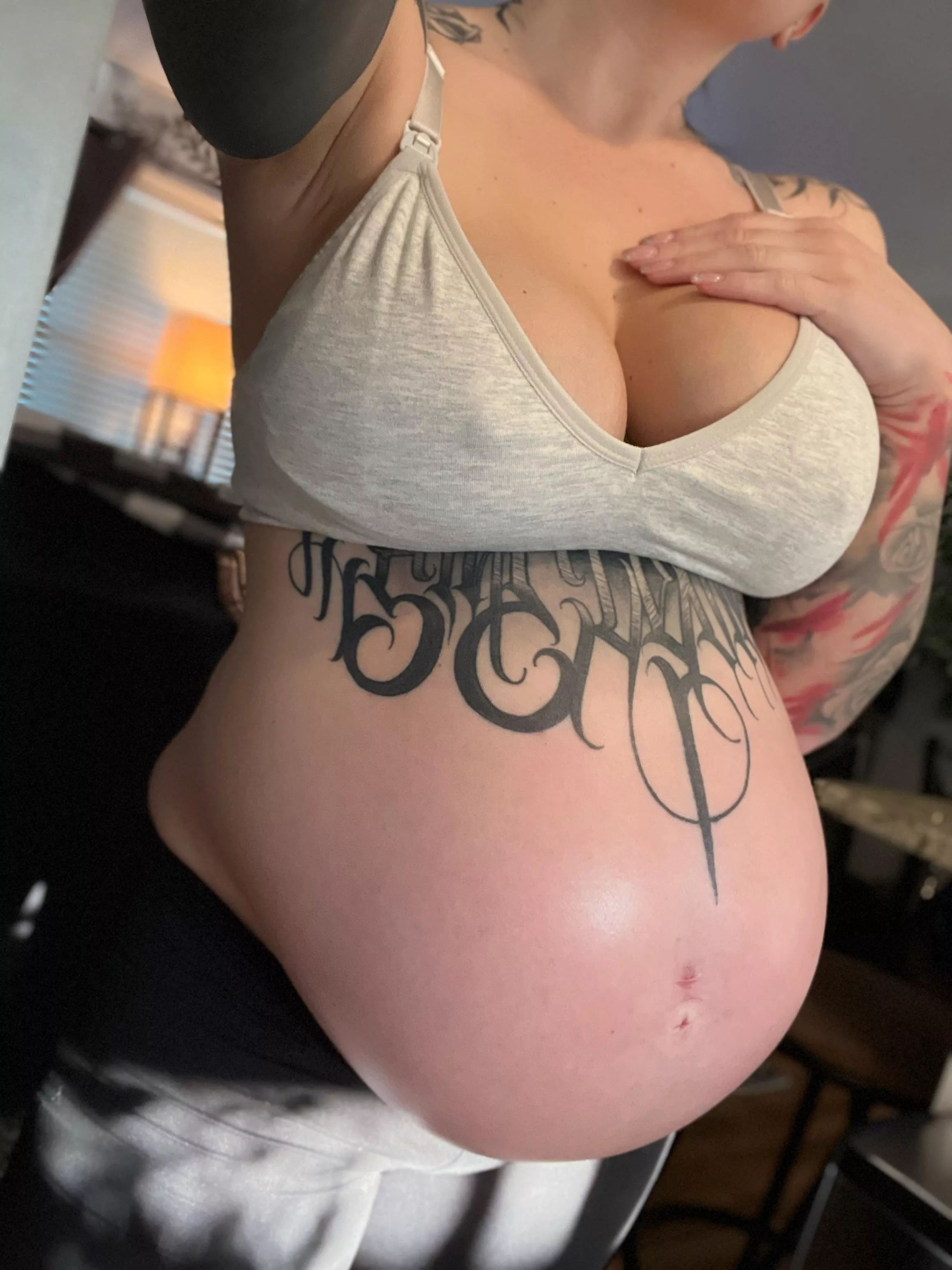 Describe my 9 month pregnant belly in 1 word.