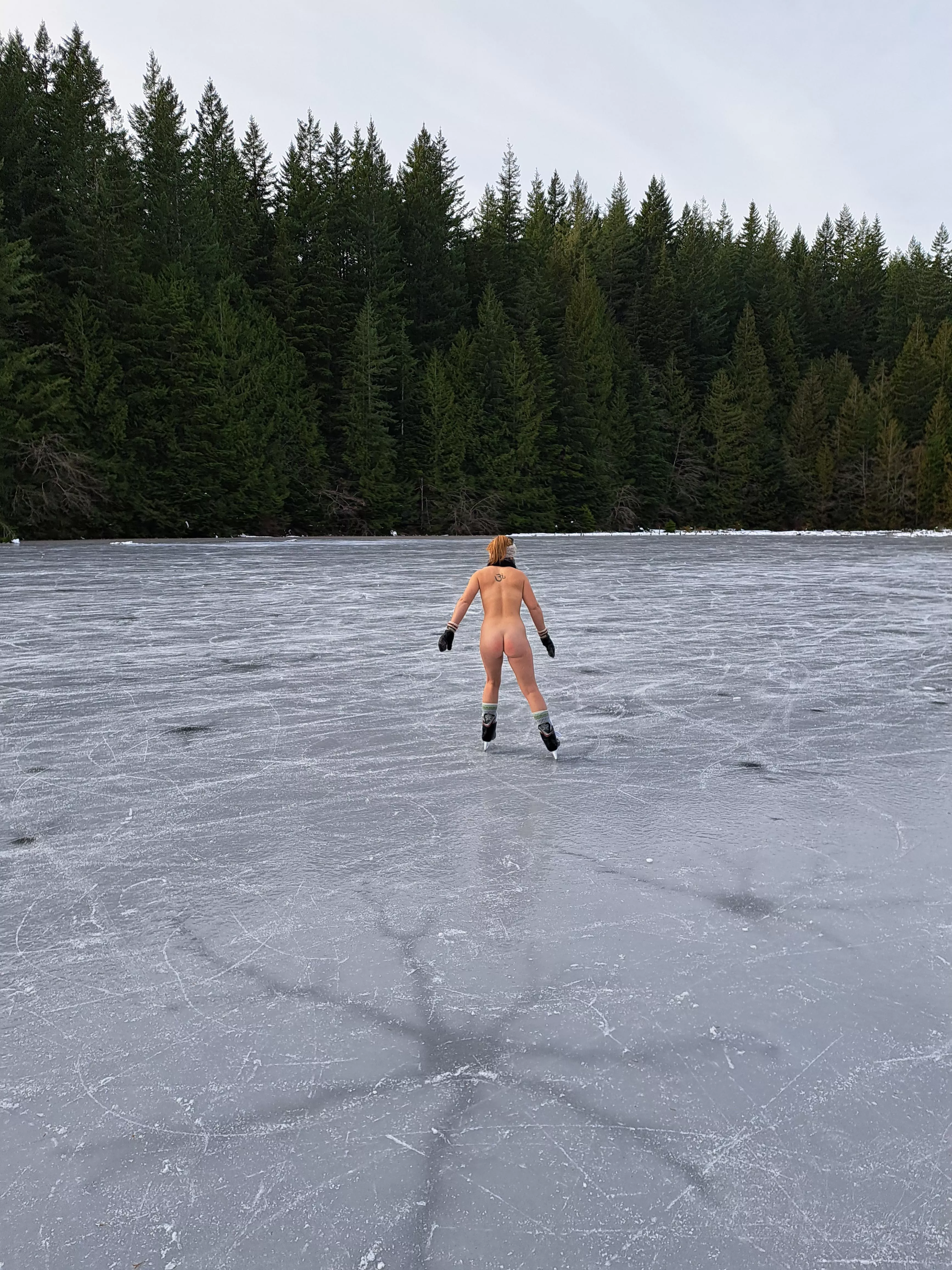 Nudist embracing winter