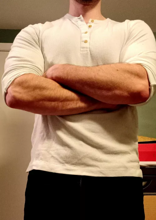 Strong forearms in a tight Henley shirt is a nice combo.