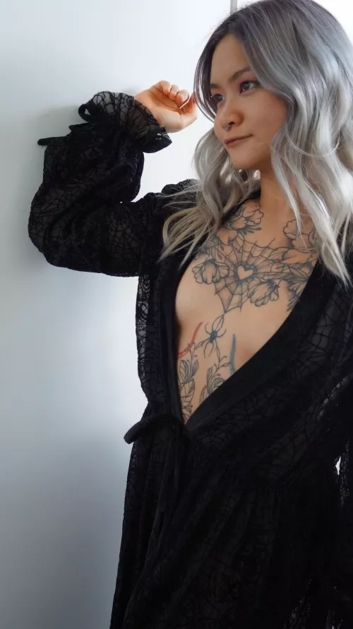 The spider webs on my robe match my tattoos