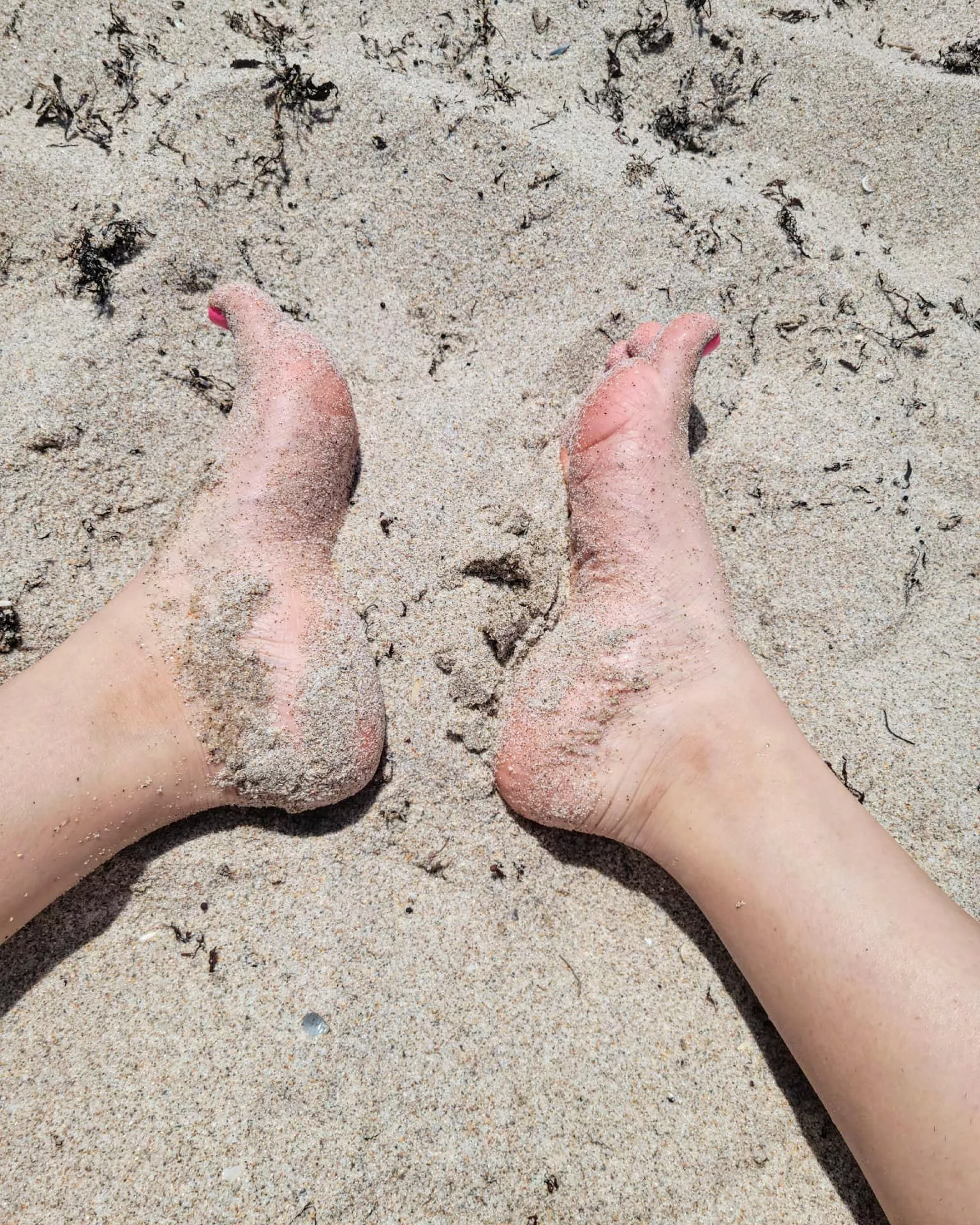 With my feet in the sand.