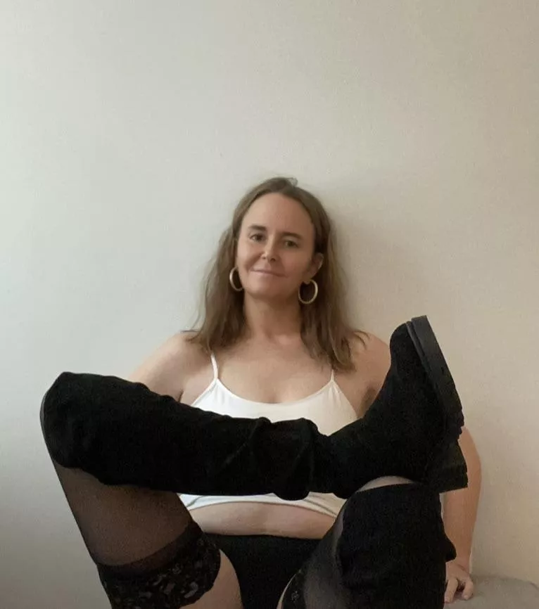 Happy sitting here in my thigh highs and tall boots