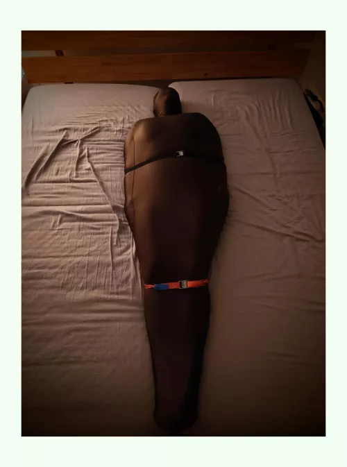 I put my wife with a diaper and Zentai suit in a body bag and tied her to the bed frame with straps. I hope she enjoyed it!