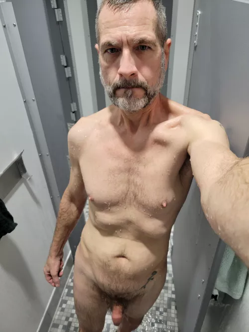 Showering with the door open so the guys at the gym can get a look.