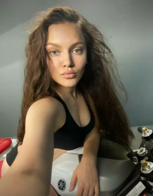 This is me in a beautiful black top, on a motorcycle.