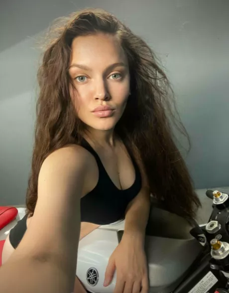 This is me in a beautiful black top, on a motorcycle.