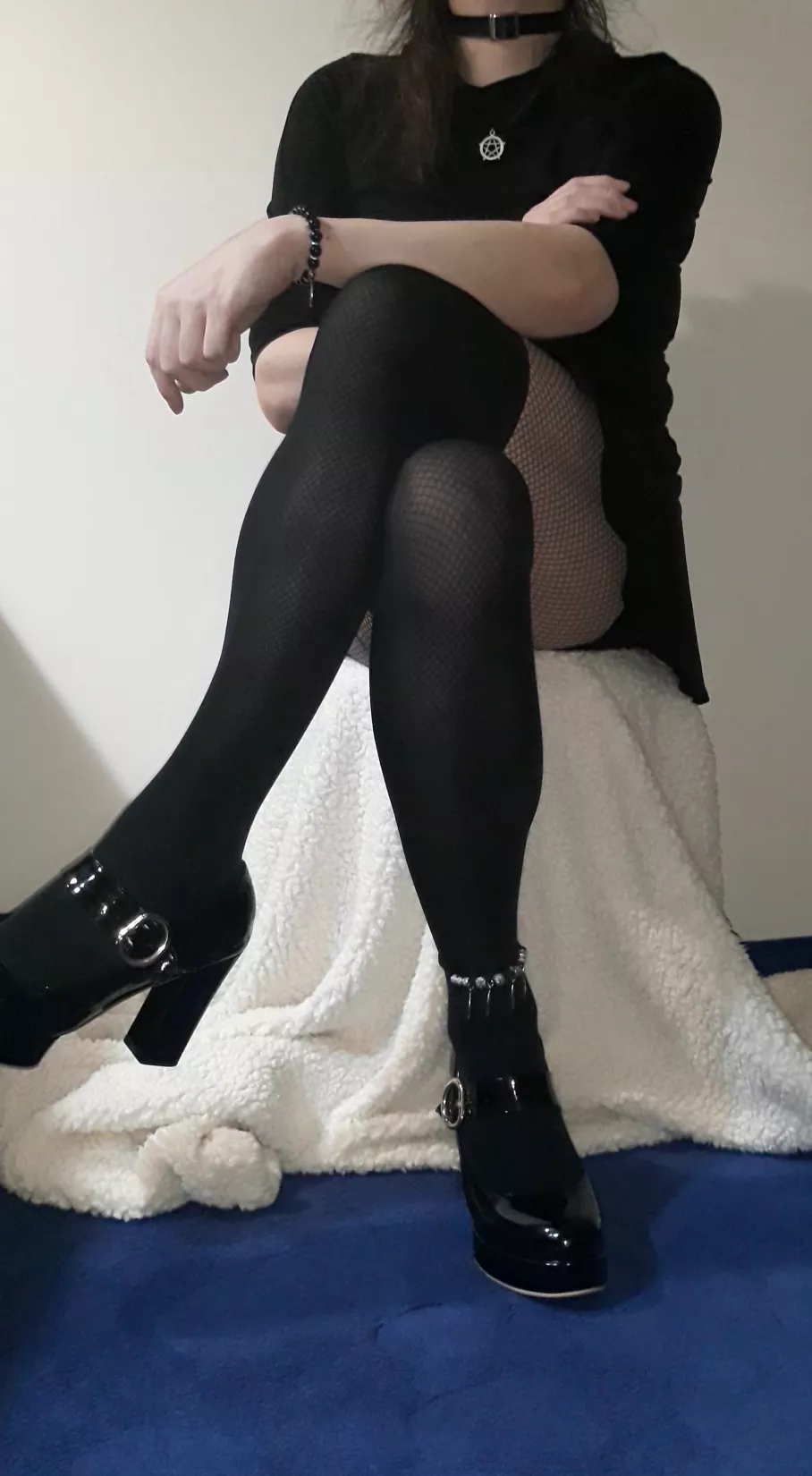 Dark outfit with trinkets