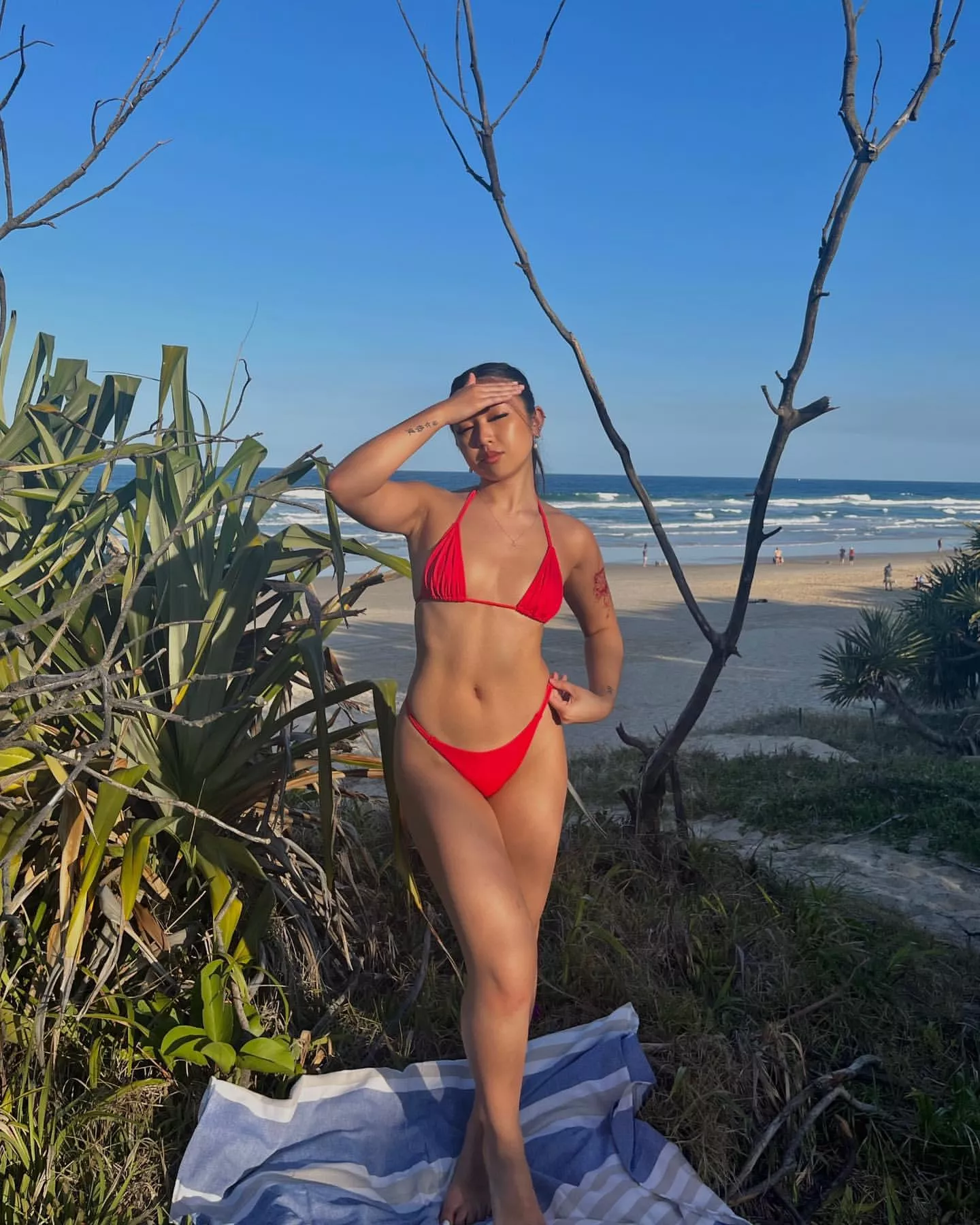 bright red bikini by the beach