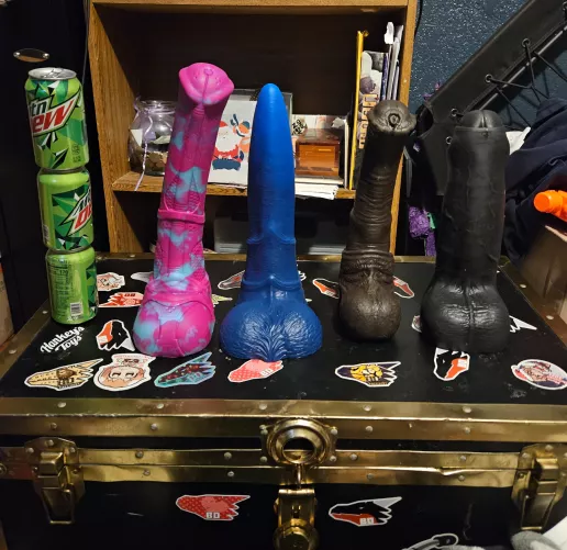 The 4 biggest boys of my 20 toys. 3 soda cans stacked for size reference. yes i can sheath all 4 of them Ask me anything. i give anal size queen advice.