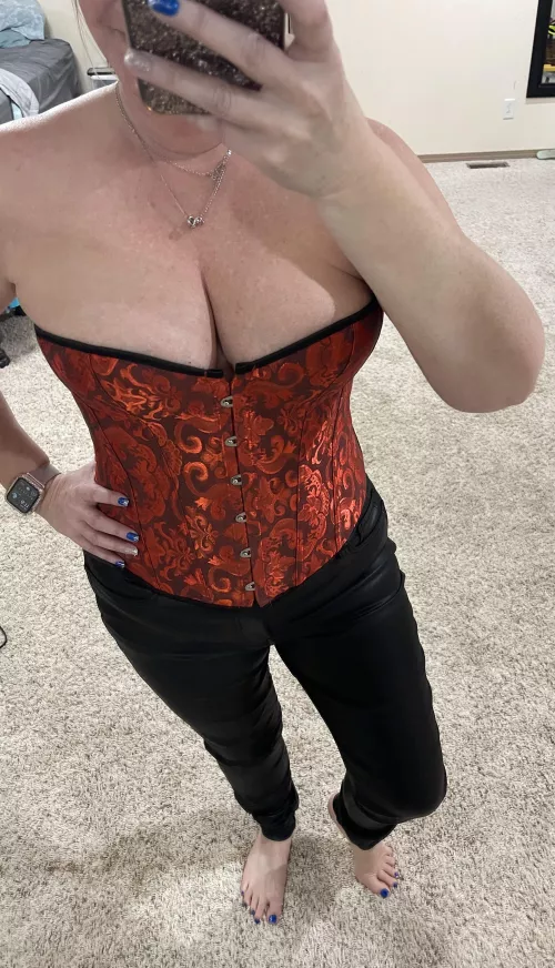 What do you notice first the bare feet or corset