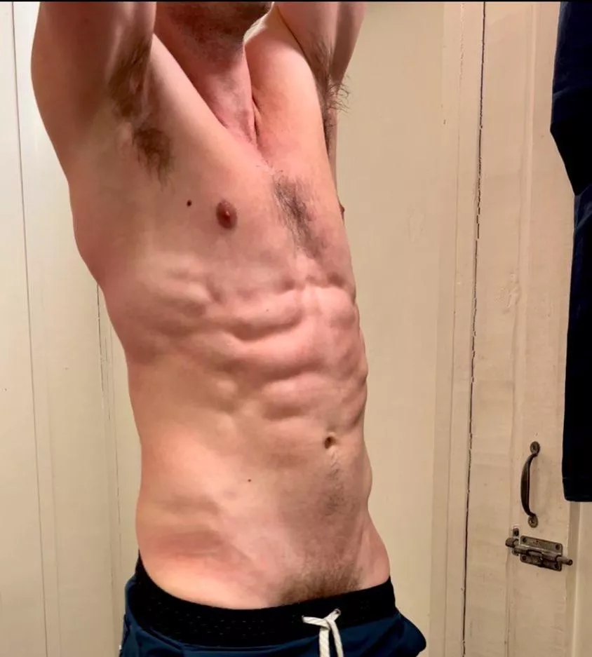 Stripping down after some pickup basketball.