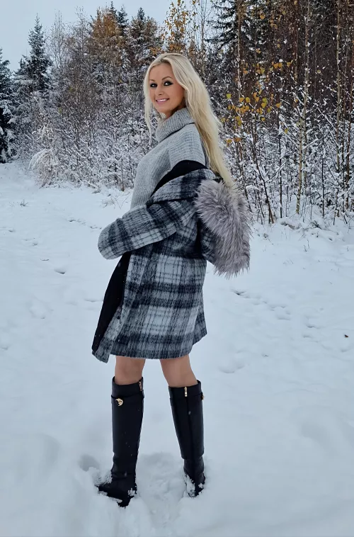 Knee high boots in the snow, covered but still sexy
