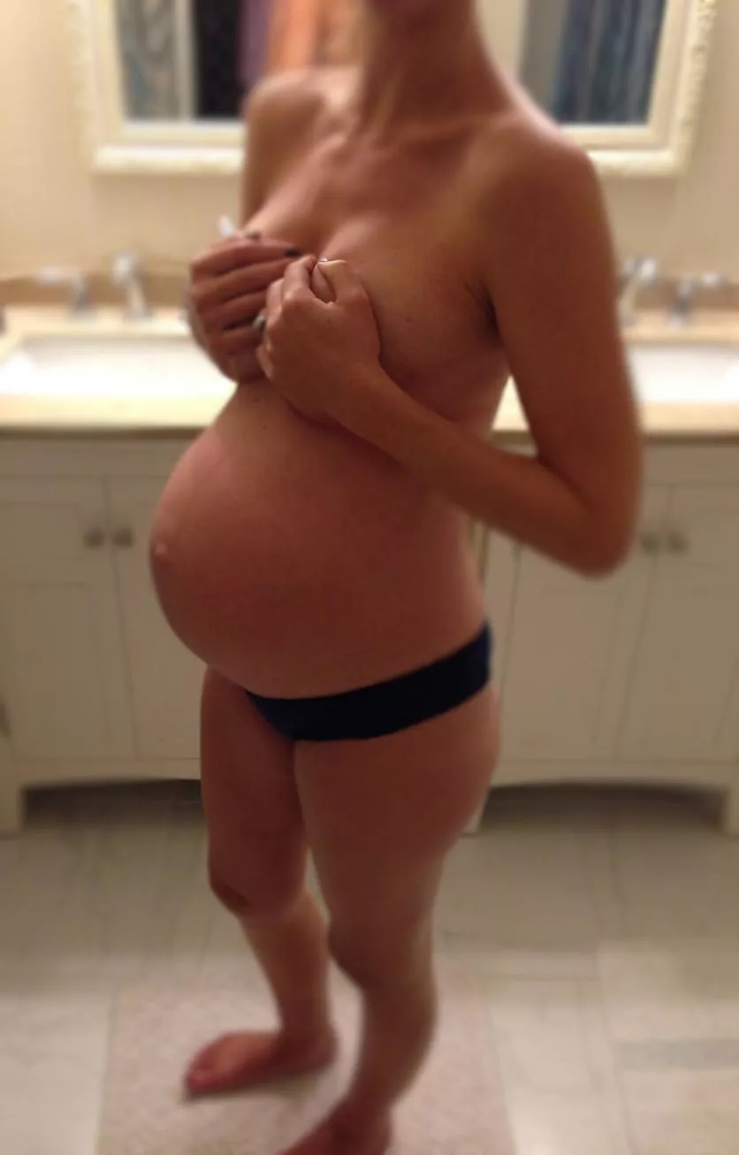 holding her swollen boobies :)