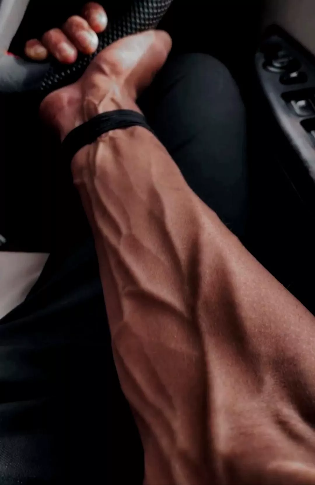 one hand on the wheel, the other gripping your thigh maybe?