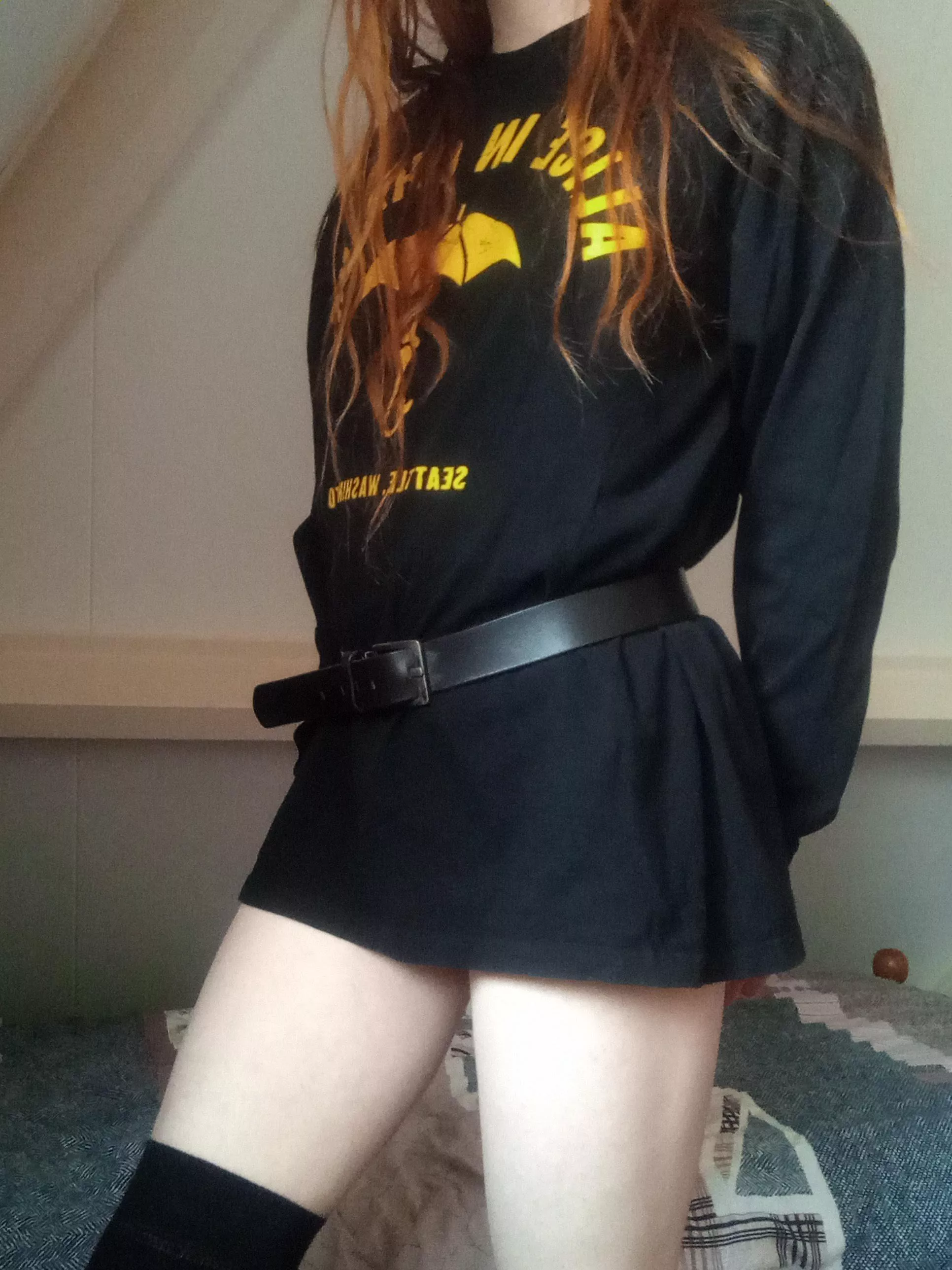 Using a belt to turn an oversized sweater into a dress. I think the result is pretty good!