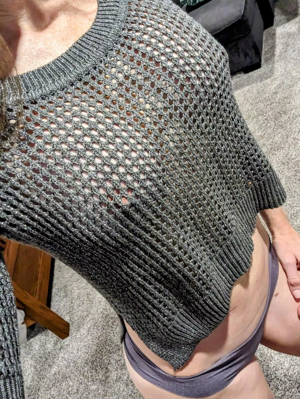 Peeking through her sweater