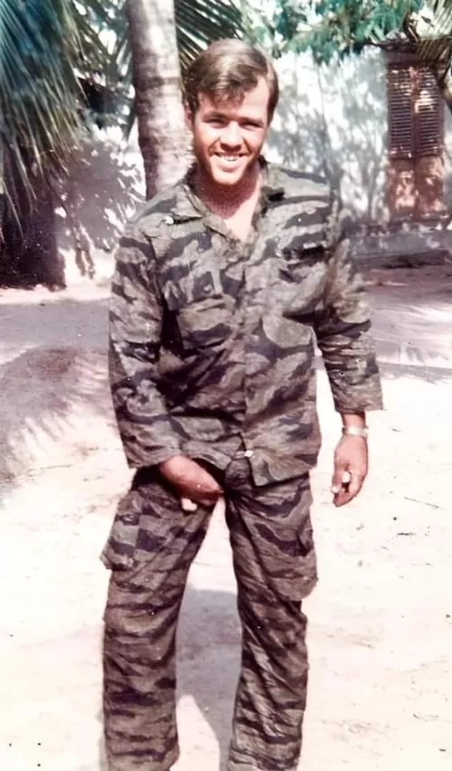 Soldier groping his uniformed bulge.