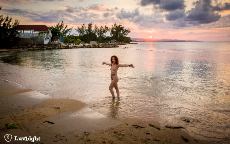 Wide shot of Dee Luvbight on the prude beach at sunset, Hedonism III, Runaway Bay, Jamaica (2008).