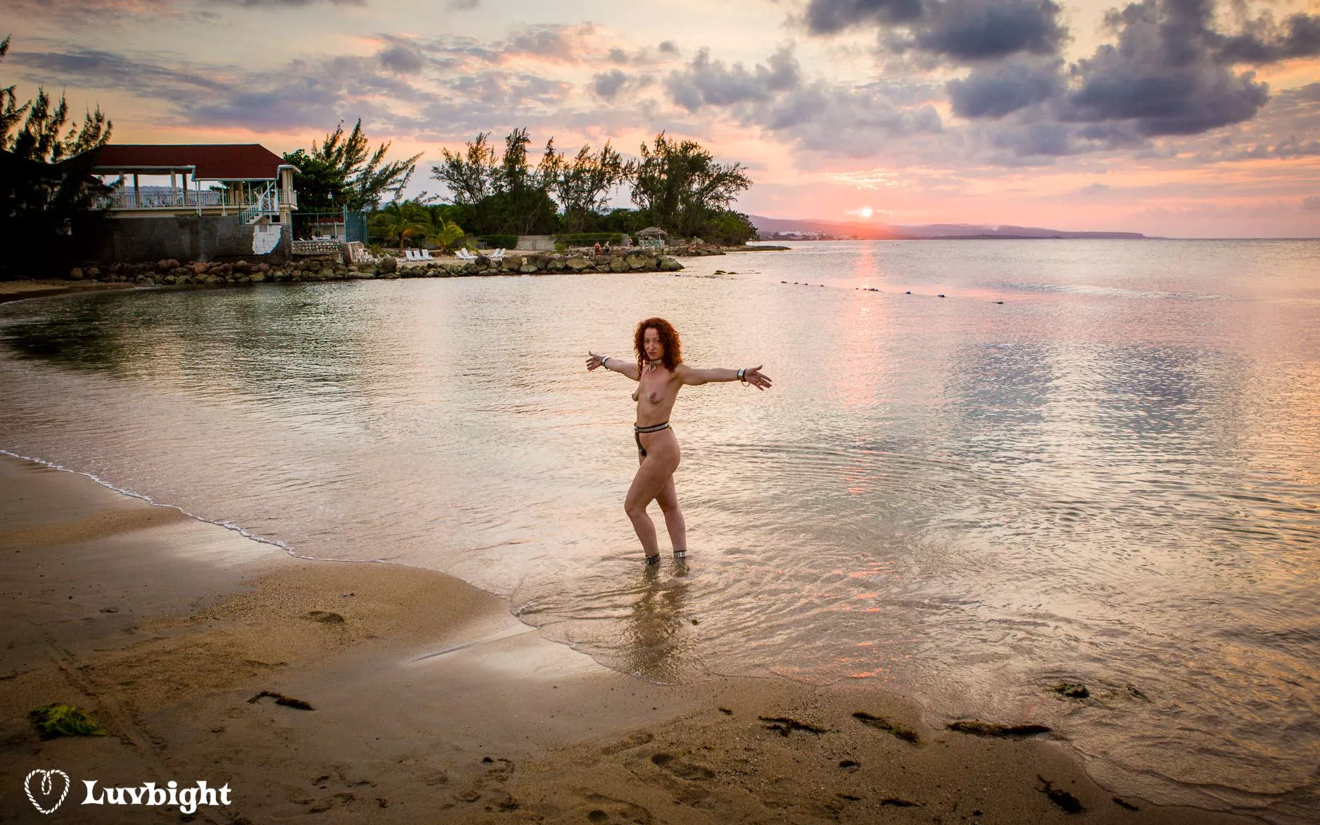 Wide shot of Dee Luvbight on the prude beach at sunset, Hedonism III, Runaway Bay, Jamaica (2008).