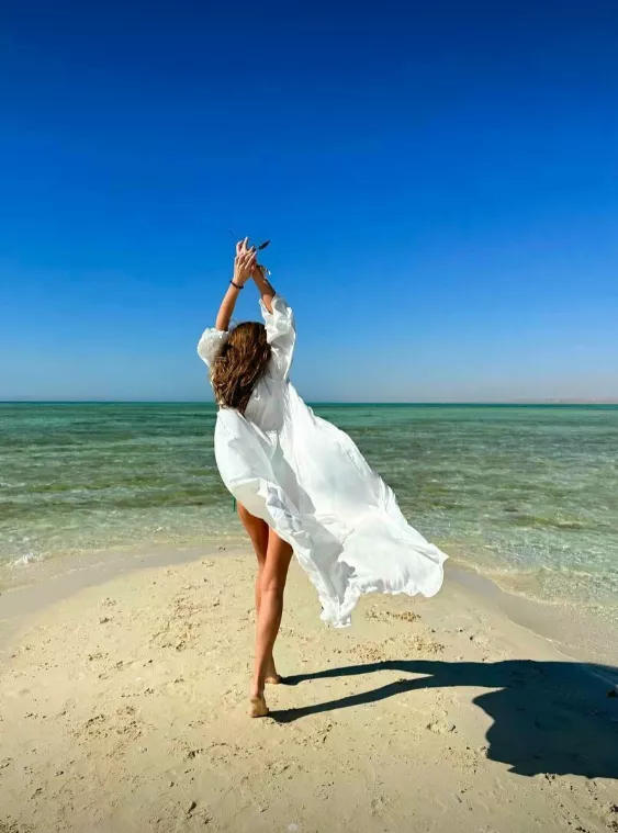 the wind lifts my dress and pleasantly tickles my genitals