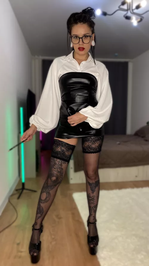 You noticed that the teacher looks a little unusual today and has something sticking out from under his dress. Would you be embarrassed to stay after class and find out?