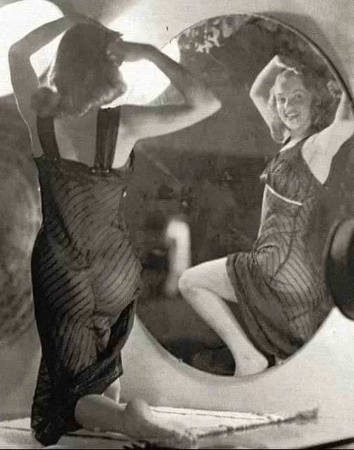 Norma Jeane Mortenson in front of a mirror, 1947. Photo by Earl Moran