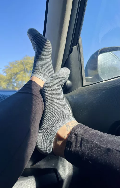 Resting my tiny feet in ankle socks on the dash