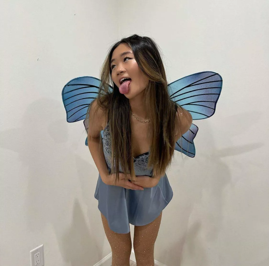 Which one is prettier? A butterfly or her?
