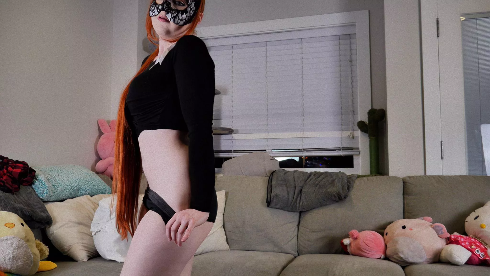 Feeling the heat with this sensual ensemble - lingerie and mask on!