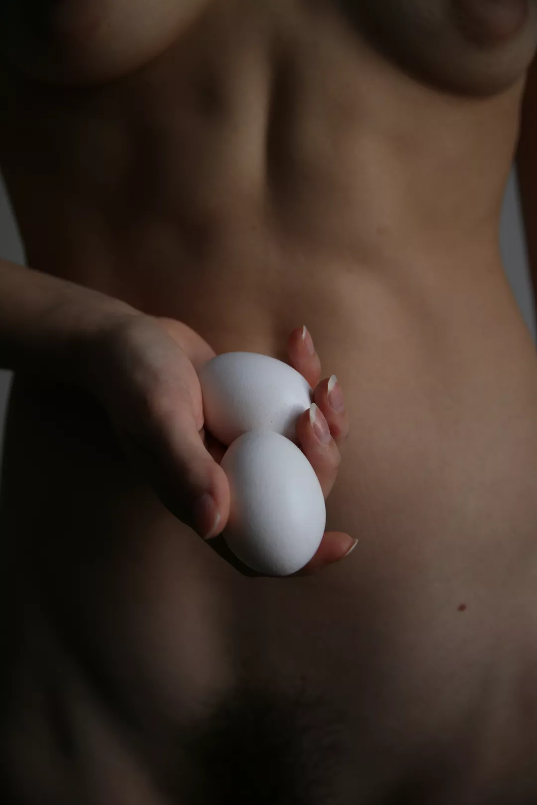Women with eggs. Selfportrait