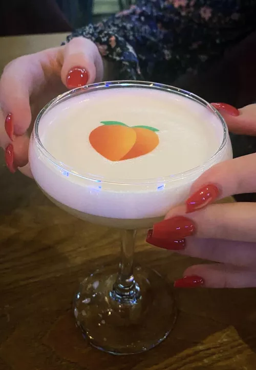 Red nails and a peach 🍑