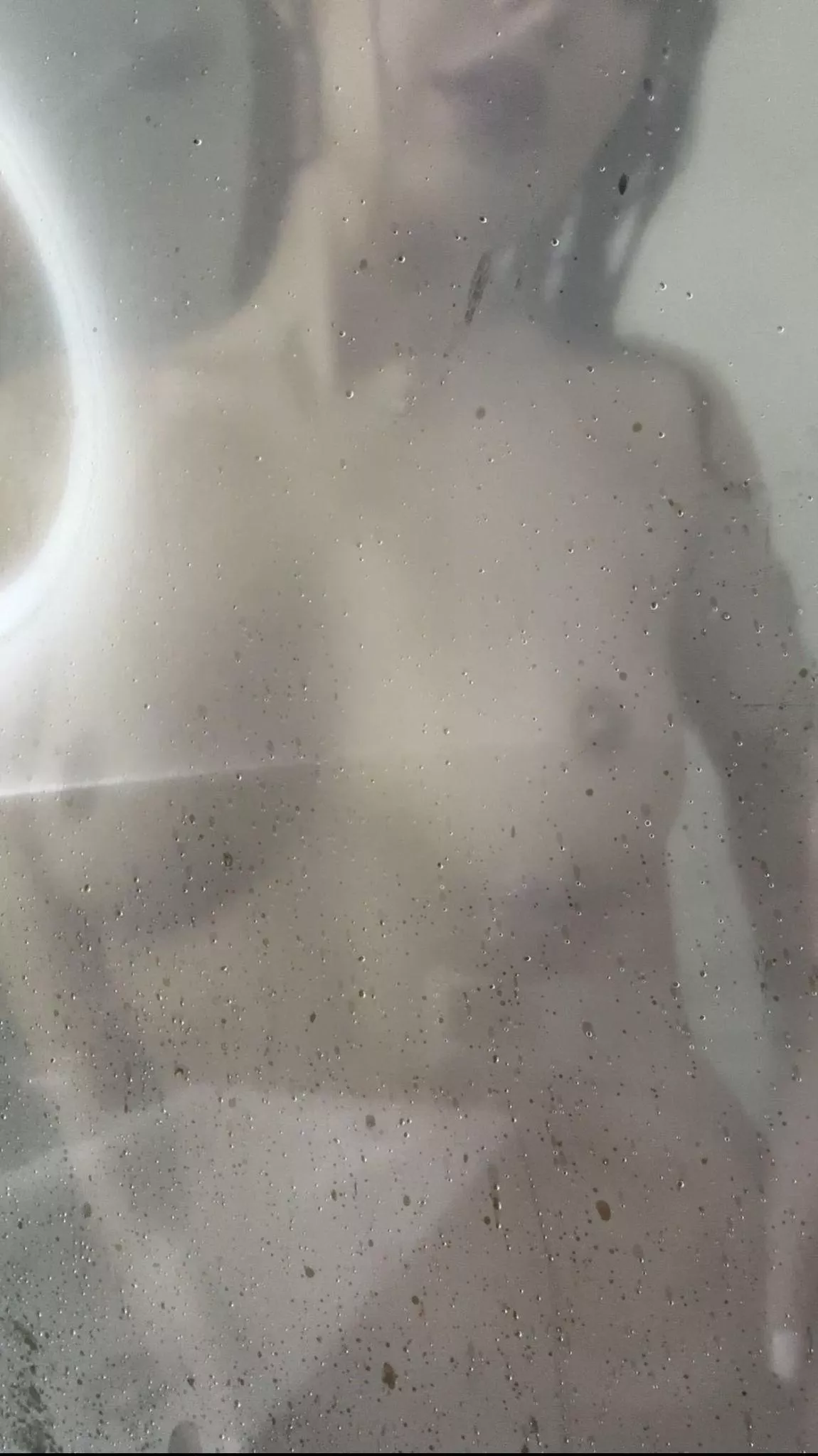 there's only one shower stall glass between us