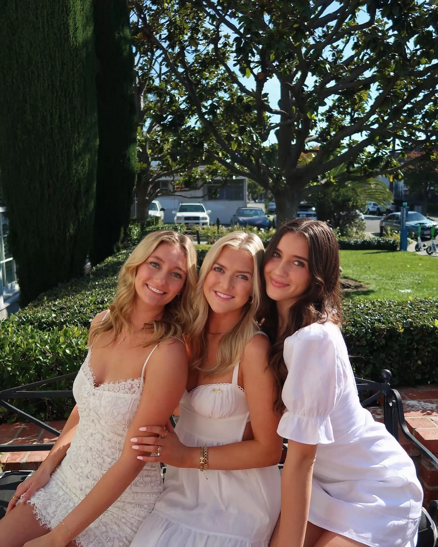 White Dresses on a Park Bench