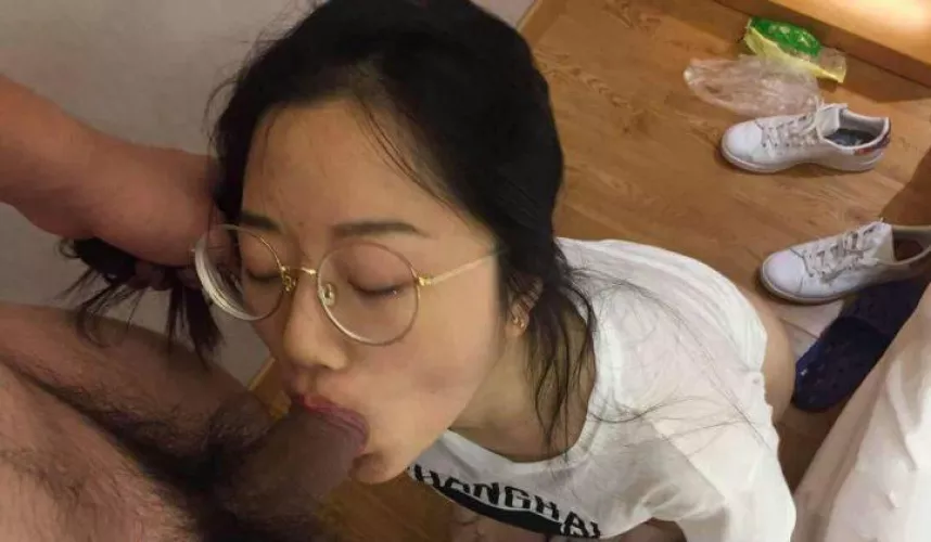 Nerdy Asian girl sucking cock