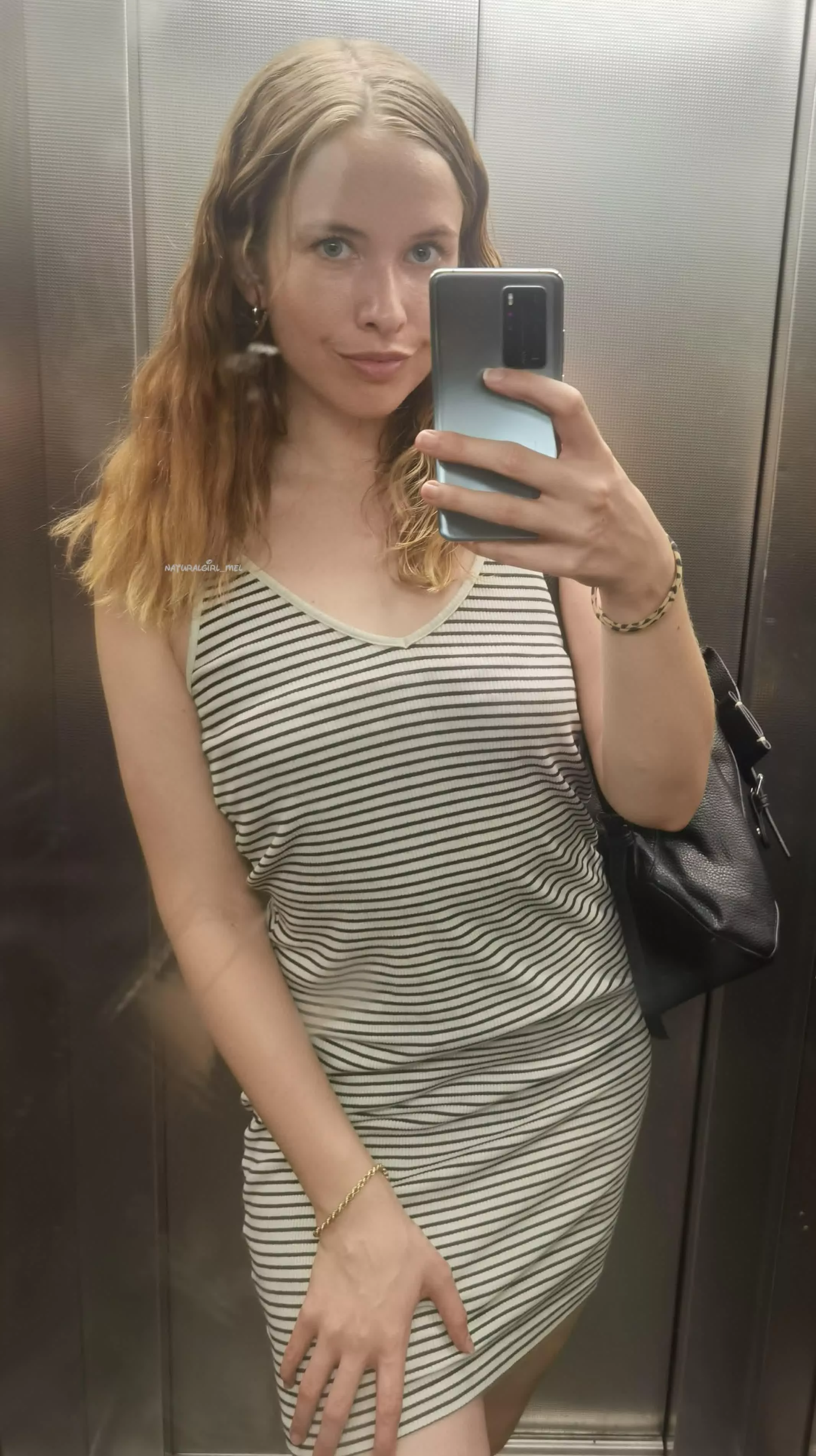 Elevator selfie in a tight summer dress