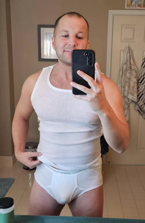 Trying on another man's briefs to see how they fit [37]