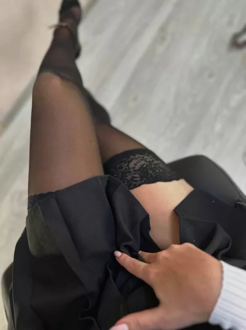 Bending on the bed in my seamed stockings