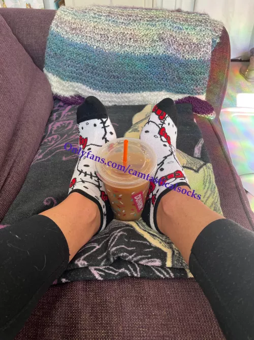 Hello Kitty is enjoying some iced coffee for a change!