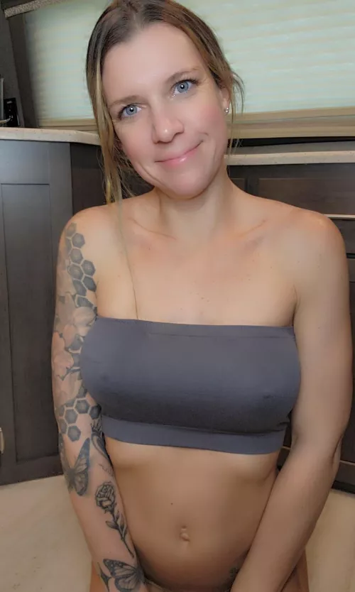 A tiny tube top & no panties on this naughty MILF. Where are you licking first..