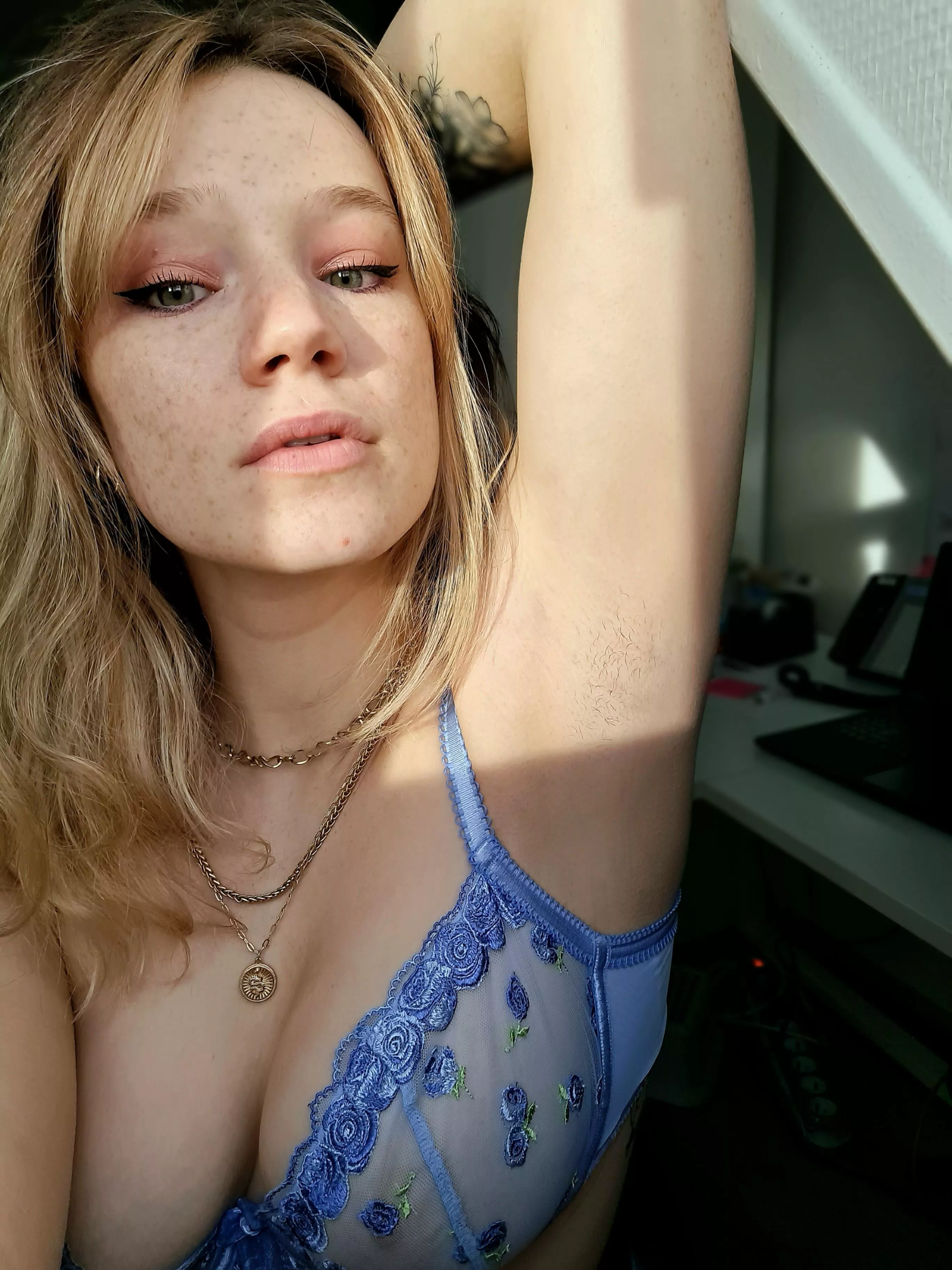 Freckles on my face, baby hair under my arm