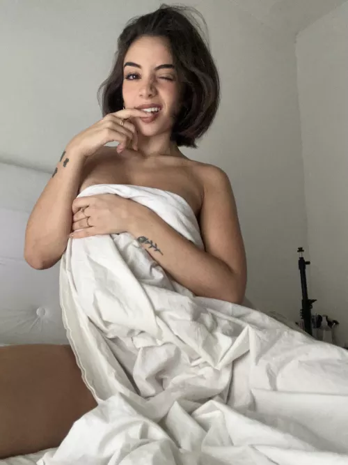 a wild Mexicana in her bed waiting for you to join