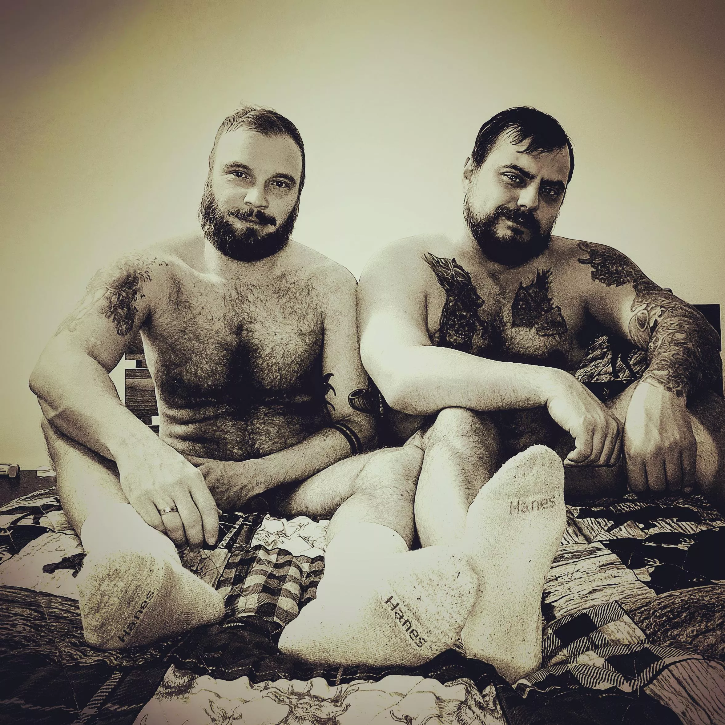 Furry otter and his bear hanging out in bed